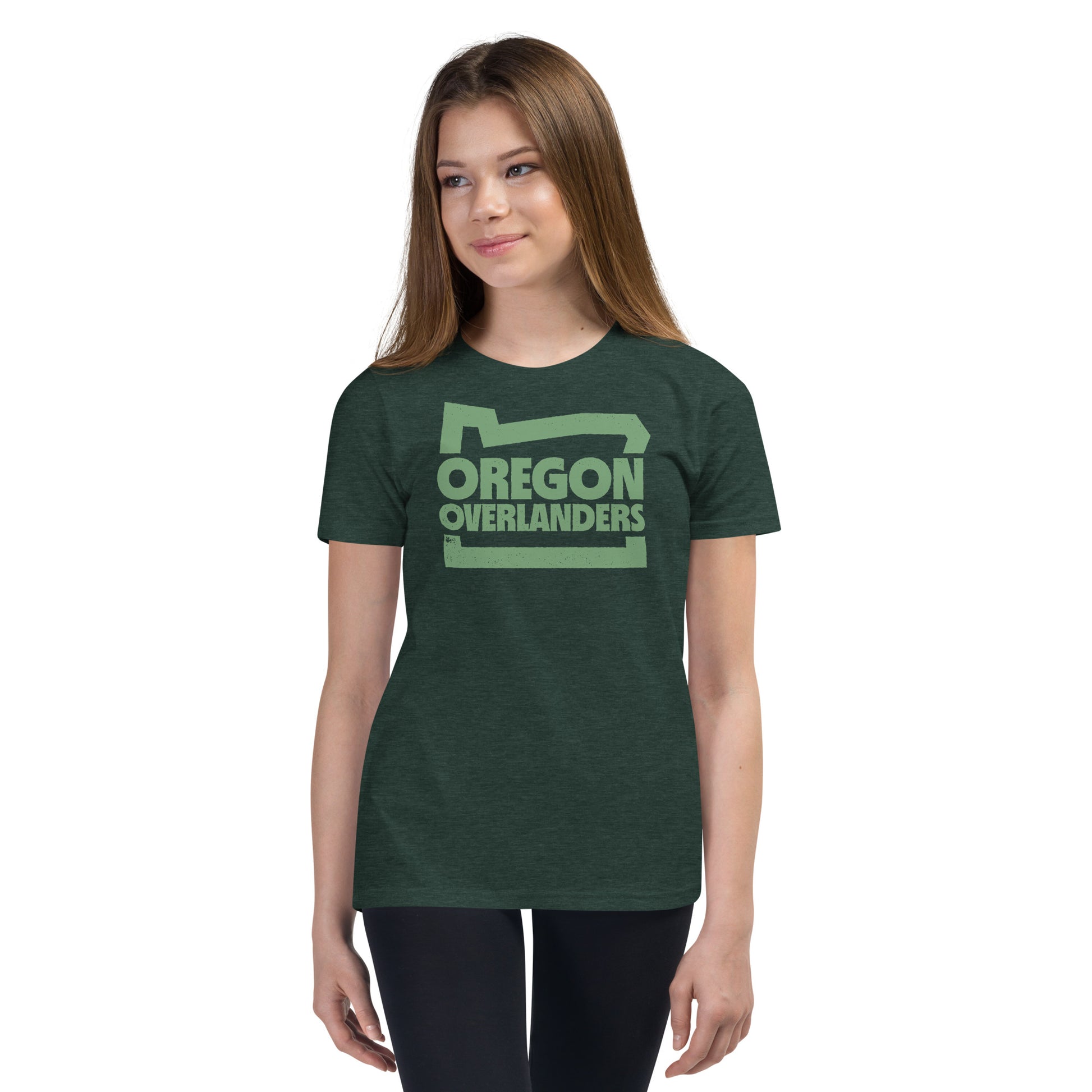 light green Oregon Overlanders logo on dark green T-shirt worn by young girl